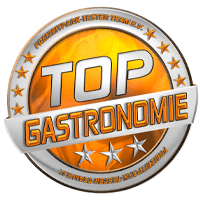 Rundes Abzeichen mit der Aufschrift 'Top Gastronomie' und drei Sternen in orange und silber.